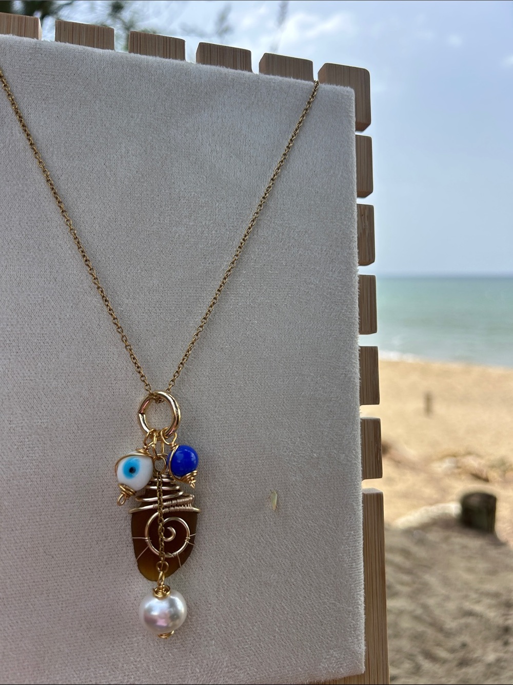 Gold Wire-Wrapped Pendant Necklace with Blue and White Accents